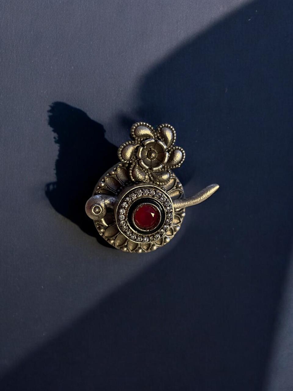 Floral and Bird Motif Oxidised Ring with Red Stone Accent