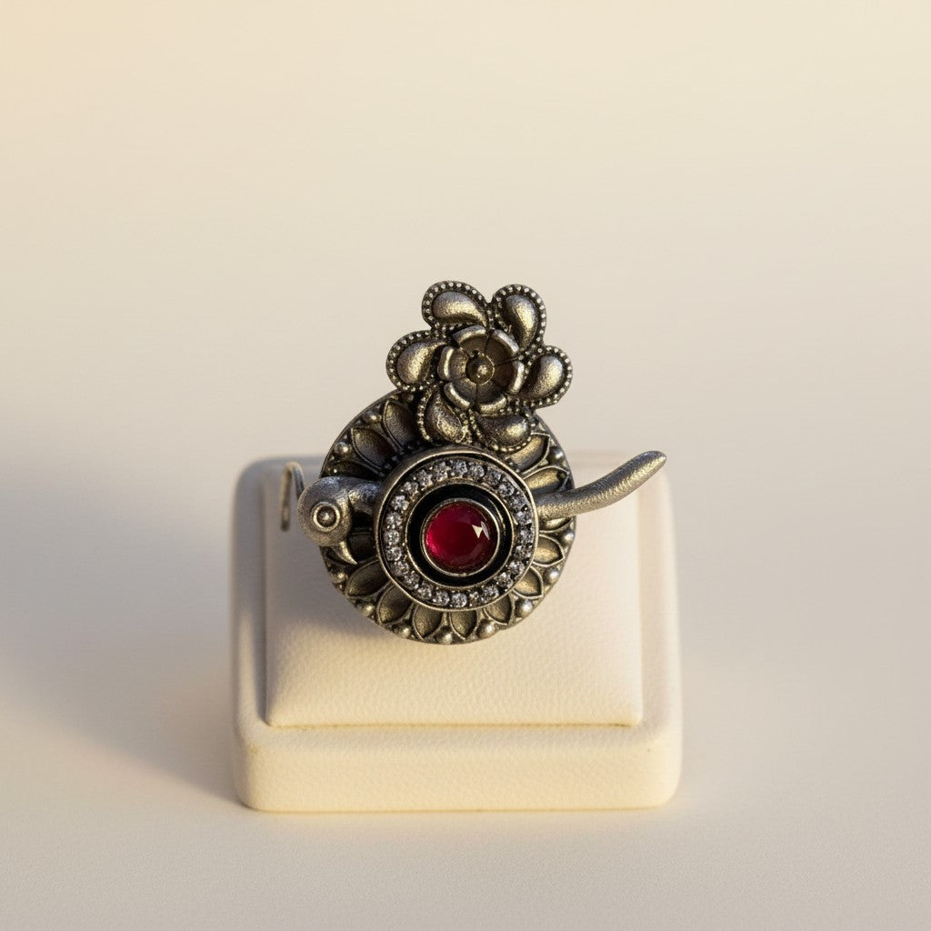 Floral & Bird Motif Oxidised Ring with Red Stone Accent